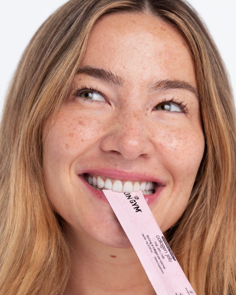 Woman biting Skin Gym's Collagen Jelly